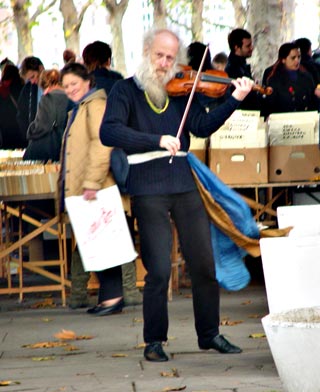 A crazy old man playing the violin